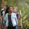 School children walking through a forest