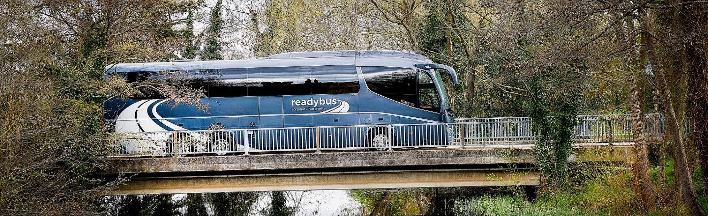 Readybus coach travelling across a bridge