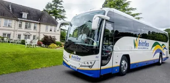 Coach infront of house